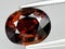 natural brown orange grossular garnet gem on the background