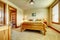 Natural cabin farm house bedroom with beige carpet and green walls.