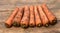 Natural carrots on wooden background, recently brought from the garden. The benefits of carrots