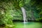 Natural cascade water flows over the rocks to the lake, Portugal