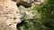 Natural Cave entrance in the rock near the forest