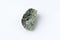 Natural chrysolite, olivine green color transparent raw crystal, close up, white background