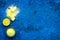 Natural citrus cosmetics. Spa salt near lemon on blue background top view mock-up
