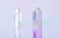 Natural clear crystal quartz electroplating rainbow on holographic background. Meditation, reiki and spiritual healing concept