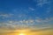 Natural Clouds formation on a blue sky in the evening with yellow