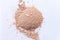 Natural colored pigment powder close up, matt skin colored eyeshadow or mica powder, pigment