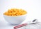 Natural corn flake breakfast cereal in cups and milk is a healthy breakfast that is good for your body every day on a white