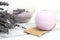 Natural cosmetics. Handmade lavender bath bombs and lavender flowers on white wooden planks