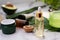 Natural cosmetics with herbal ingredients, close up. A bottle of hydrating serum or avocado aloe oil. Moisturizing and