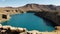 Natural dams on  lake basin with snow covered mountains.