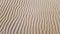 Natural desert sand background with wind ripples lines or waves effects