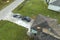 Natural disaster and its consequences. Hurricane Ian destroyed house roof in Florida residential area