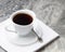 Natural drink chicory in a white Cup with a saucer on a white napkin