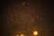 Natural drops of water on glass, night photo with a street lights outside