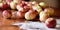 Natural eco-farm apples laying on the wooden table.