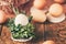 Natural eggs in basket from bunch plant on wooden in sunny morning