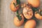 Natural eggs with bunch plant and dried flowers on grey concrete background