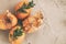 Natural eggs with bunch plant and dried flowers on grey concrete background