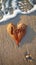 Natural expression Heartfelt Love inscription on sandy beach with leaf