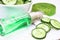 Natural extract from cucumber. Cosmetics care with cucumber extract on a light background