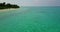 Natural flying island view of a white paradise beach and blue water background in 4K