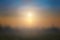 Natural fog and mountains sunlight background blurring, misty waves warm colors and bright sun light. Christmas background sky