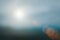Natural fog and mountains sunlight background blurring, misty waves warm colors and bright sun light. Christmas background sky