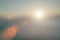 Natural fog and mountains sunlight background blurring, misty waves warm colors and bright sun light. Christmas background sky