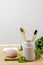 Natural four bamboo toothbrushes in ceramic dish