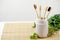 Natural four bamboo toothbrushes in ceramic dish