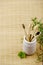 Natural four bamboo toothbrushes in ceramic dish