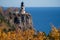 Natural framing of Split Rock Lighthouse on the North Shore of Minnesota, framed by fall leaves