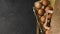 Natural fresh chicken eggs in eco package, rolling pin on a dark kitchen table. Top view. Flat lay. Kinfolk style. Copy space