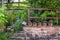 Natural garden with stone wall, native plants and insect hotels, bug hotels, insect houses.