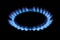 Natural gas burning a blue flames on black background, propane is burning on the gas cooker.