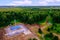 Natural gas distribution station of main gas pipeline. View from above. Type of gasification object on summer day.