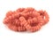 Natural gemstone pink coral beads on a white background