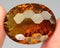 Natural gemstone wine imperial topaz on a gray background