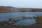 Natural geothermal pool next to Reykjafoss waterfall, iceland