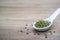 Natural grains, consisted of green bean seeds in spoon on vintage style wooden background