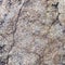 Natural granite stone texture background. Rough and rusty. Close-up