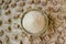 Natural,granulated brown sugar in bamboo bowl on the brown sugar cubes