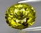 natural green grossular garnet gem on the background