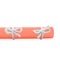 Natural handmade cord knots tied on orange letter roll isolated
