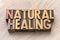 Natural healing word abstract in wood type