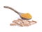 Natural herbs, fresh turmeric and turmeric powder in wooden spoons and capsules separately on white background