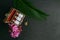 Natural Homeopathic medicine concept - Close view of homeopathy medicine bottles in wooden old box with pink flower, wild flower