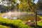 Natural hot spring with steam, rock and reflection in the morning at Chae Son National Park, Lampang, Thailand