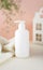 Natural Hypoallergenic Foam for bathing children. White Plastic pump bottle. children's cosmetics. Bottles on a pink