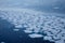 Natural ice blocks breaking up against shore and sea